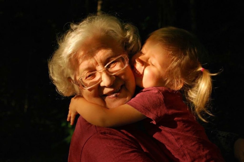 Grandmother hugging her grandchild