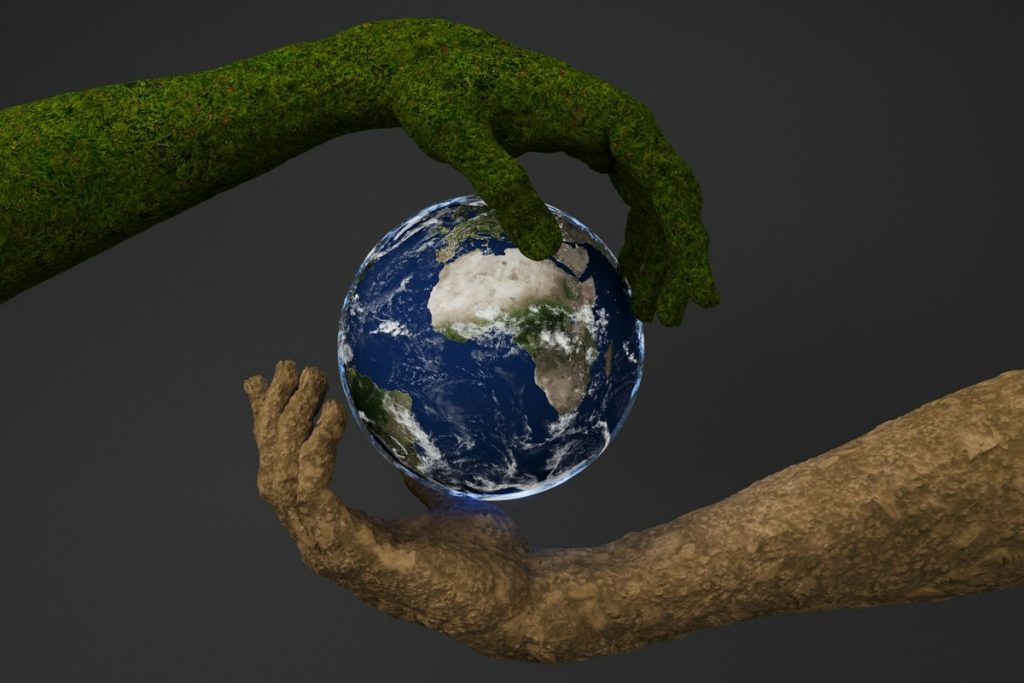 Hands holding a small globe
